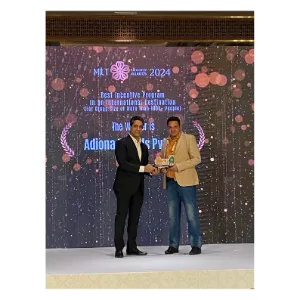 Adiona’s team receiving an award on stage at MILT Asia 2024