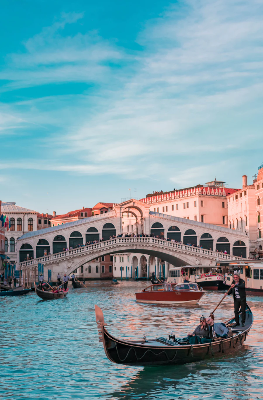Gondolas passing the Rialto Bridge on Venice's Grand Canal