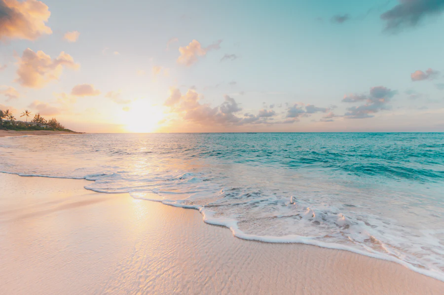 Waves breaking on a quiet tropical beach at sunrise