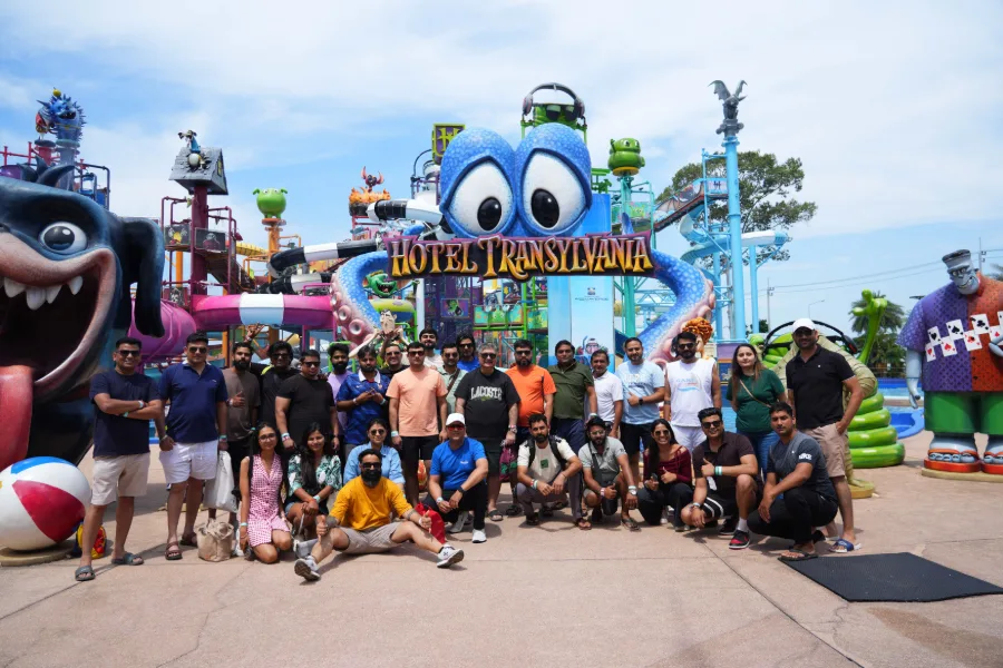 The Adiona team posing in front of the Hotel Transylvania gate at a water park